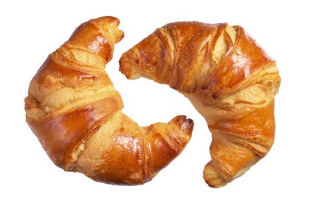 Two fresh croissants isolated on a white backgroundの写真素材