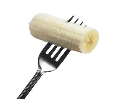 Slice of banana on a fork isolated on white backgroundの写真素材
