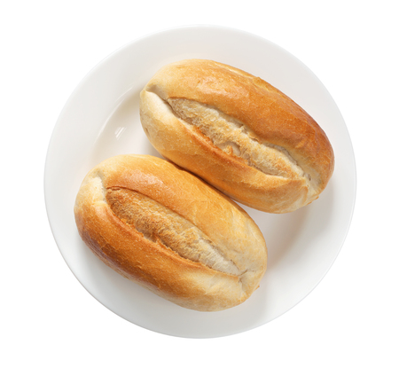 Two loaves of small wheat bread in plate isolated on a white background, top viewの写真素材