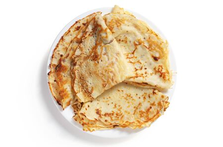 Fried pancakes in plate on white background close-up, top viewの写真素材