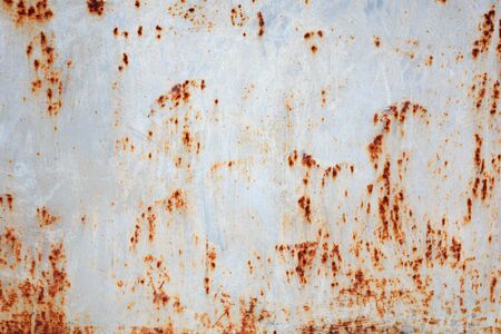 Rusty metal texture background with cracked paint close-up