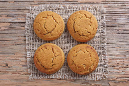 Oatmeal cookies on rustic wooden table, top view