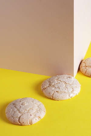 Amaretti almond cookies on two-tone background or table
