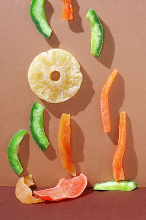 Composition of various tropical fruits on two-tone background or tableの写真素材
