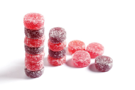 Stack of fruit pastilles sweets on white background close-upの写真素材