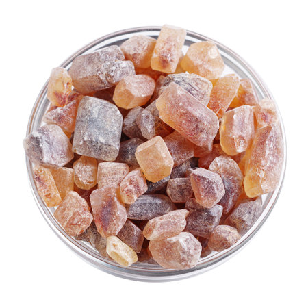 Large caramelized sugar in glass bowl on white background, top viewの写真素材