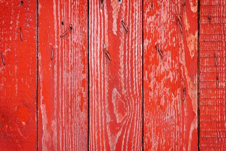painted old wooden wall, red background, fenceの写真素材