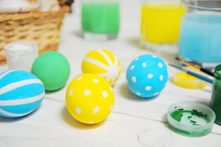 Close up of colorful Easter eggs in a basket. brush, paintの写真素材