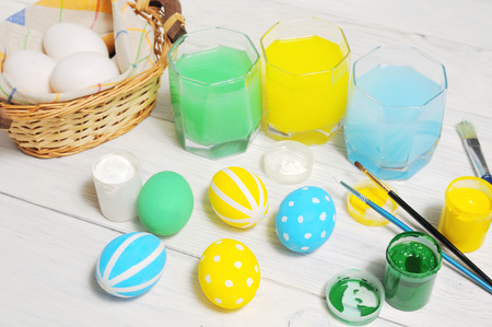 Close up of colorful Easter eggs in a basket. brush, paintの写真素材
