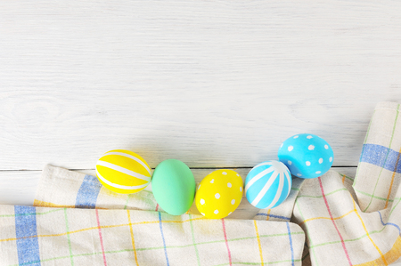 Close up decorating Easter eggs and napkin. rustic white backgroundの写真素材