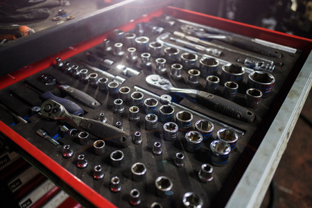 Customers or an employee (builder, repairman, master) select a tool for a wrench (tools). Car repairの写真素材