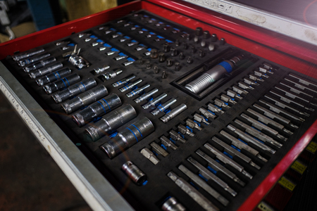 Customers or an employee (builder, repairman, master) select a tool for a wrench (tools). Car repairの写真素材