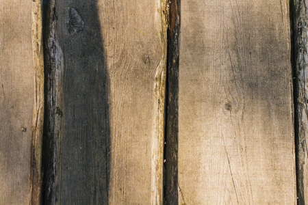 Outdoor wood texture with sun bright with rough panelsの写真素材
