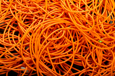 Orange abstract cable background, with interesting light. copy paste texture with natural colorful comunications.の写真素材