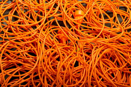 Orange abstract cable background, with interesting light. copy paste texture with natural colorful comunications.の写真素材