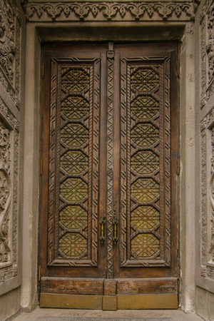 Old vintage door from 19th century in brown color in the center of Kyivの写真素材