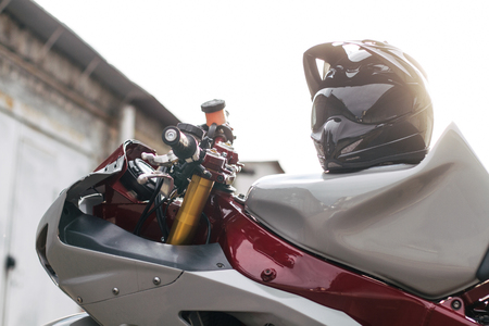 A close up of stunt motorcycle with a lot of open parts and beautiful light on backgroundの写真素材