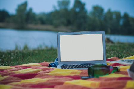 A laptop with white screen on colorful background, perfect for freelancer work illustrationの写真素材