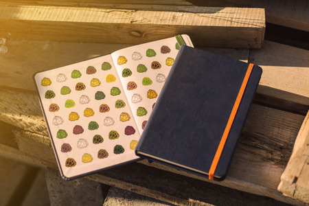A blue sketchbooks on industrial background on sunset