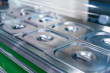 Metal polished buffet steel tray in fast food restarauntの写真素材