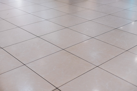 Beige tile on the floor in perspectiveの写真素材
