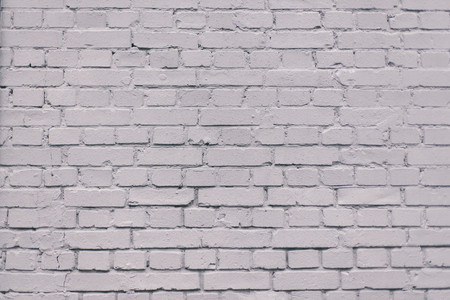 Grunge industrial grey painted brick wall background in Kyiv, Ukraine. May be used in design and interiors.の写真素材