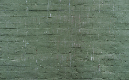 plaster texture with deep facture painted in green colorの写真素材