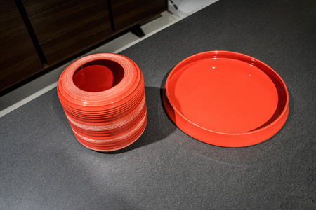 Red tableware on loft stylish table backgroundの写真素材