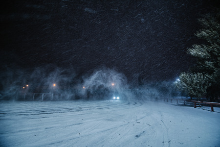 Winter parking with snowstorm and lot of frosty fresh snowの写真素材