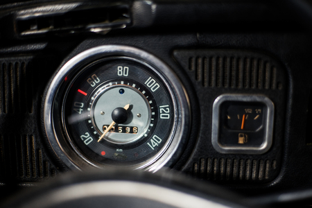Old car dashboard and instrument claster on dark interiorの写真素材