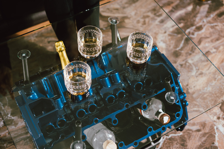 View from the top. Hands of people with glasses of whiskey or wine, celebrating and toasting of the wedding, meeting or other celebrationの写真素材