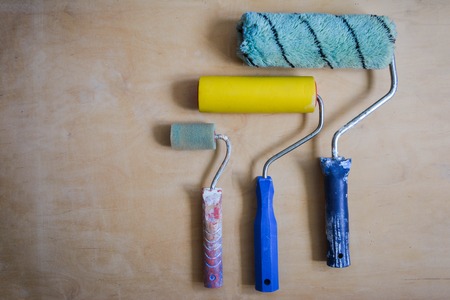 Set of instruments for making repair on wooden background in details