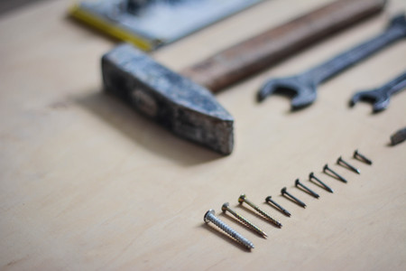 Set of instruments for making repair on wooden background in detailsの写真素材