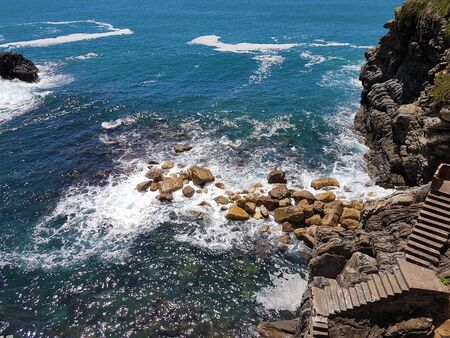 Italy, Cinque Terre, Monterosso Al Mare. Beautiful view of a coast line with greenery, turquoise sea...