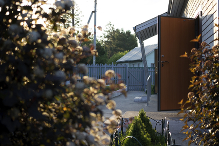 Summer evening at the house with an open doorの写真素材