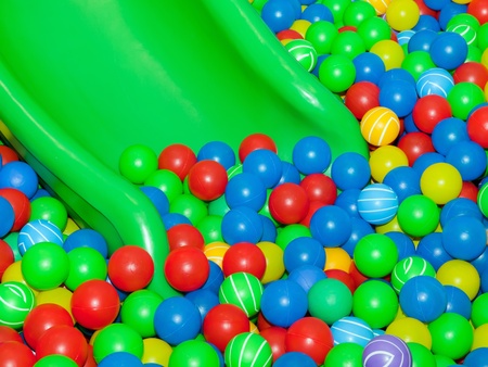 Playground slide and plastic balls の写真素材