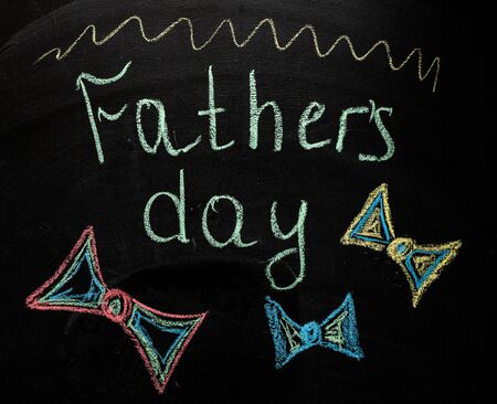 Hand writing fathers day on chalkboard on wood background. Father day. My dad my hero. Sketch. Love to parents concept. Father relationship. Love. Family conceptの写真素材
