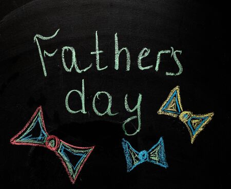 Hand writing fathers day on chalkboard on wood background. Father day. My dad my hero. Sketch. Love to parents concept. Father relationship. Love. Family conceptの写真素材