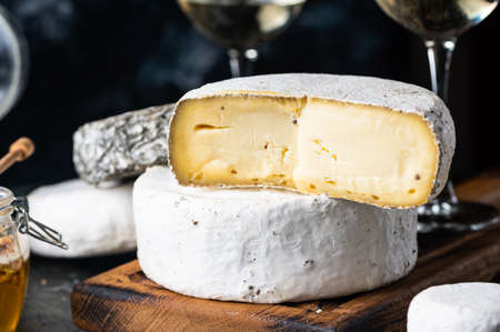 Various types of cheese composition. Gorgonzola, camembert, brie cheese. Roquefort, dor blue. Walnut...