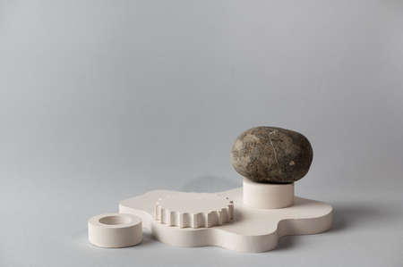 Minimal abstract cosmetic background with stone for product presentation. Cosmetic bottle podium on...