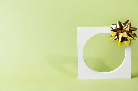 Christmas mock up with white podium on green background with christmas decor. Place for christmas product presentation. New year cosmetic podium. Christmas advertising. New Year mockupの写真素材