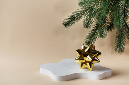 Christmas mock up with white podium on beige background with christmas decor. Place for christmas product presentation. New year cosmetic podium. Christmas advertising. New Year mockup.の写真素材