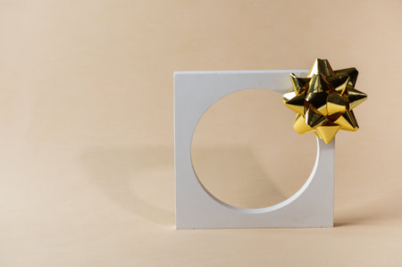Christmas mock up with white podium on beige background with christmas decor. Place for christmas...
