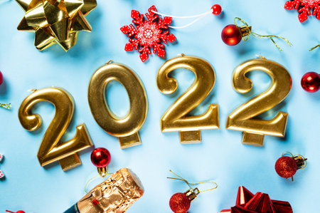 2022 number with champagne bottle and decor. Happy new year and festive concept. Top horizontal view, copyspace. New Year Flatly. Christmas flatlay. New year 2022. New year concept.の写真素材