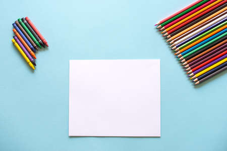 A set of bright stationery items on a blue background. Colour pencilsの写真素材