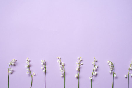 A pink notebook with a shiny decor lies next to a pen on a pink backgroundのeditorial素材