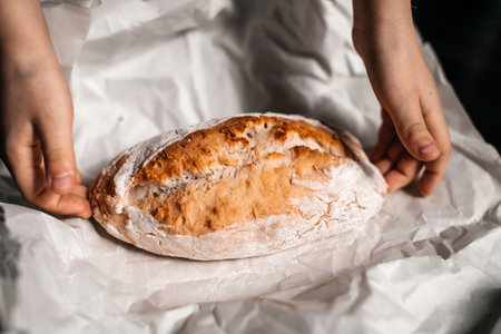A pink notebook with a shiny decor lies next to a pen on a pink backgroundのeditorial素材