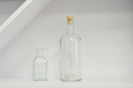 White empty glass decorative bottles in the interiorの写真素材