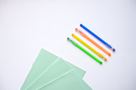 A set of stationery on a white background, pens of different colors.の写真素材