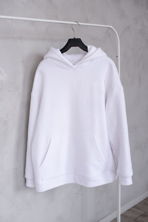 The white bike is hanging on a hangerの写真素材